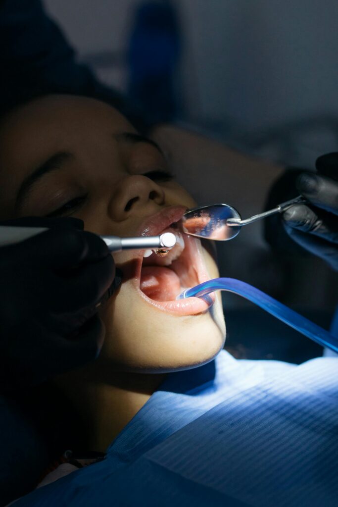 pexels-photo-6502553-6502553 Close-up of a child receiving a dental checkup at a clinic, focusing on oral care.